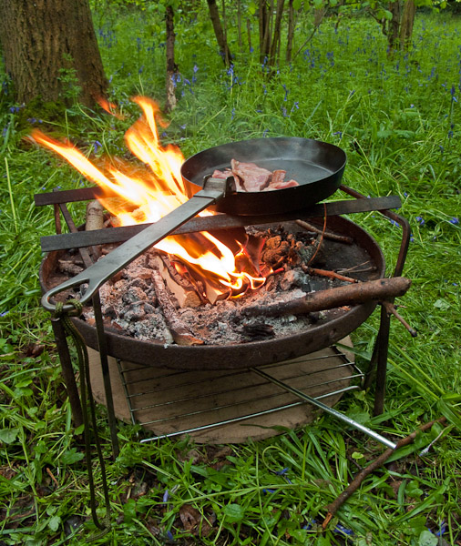 Fire tray with breakfast on the go. - ©  Gary Waidson - Ravenlore Bushcraft and Wilderness skills.